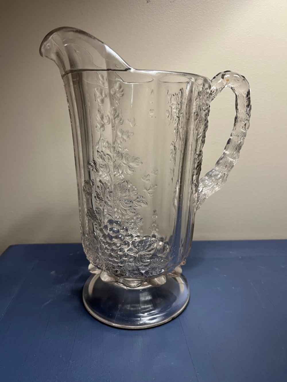 Westmoreland Glass pitcher with a clear, pressed "Paneled Grape"design.